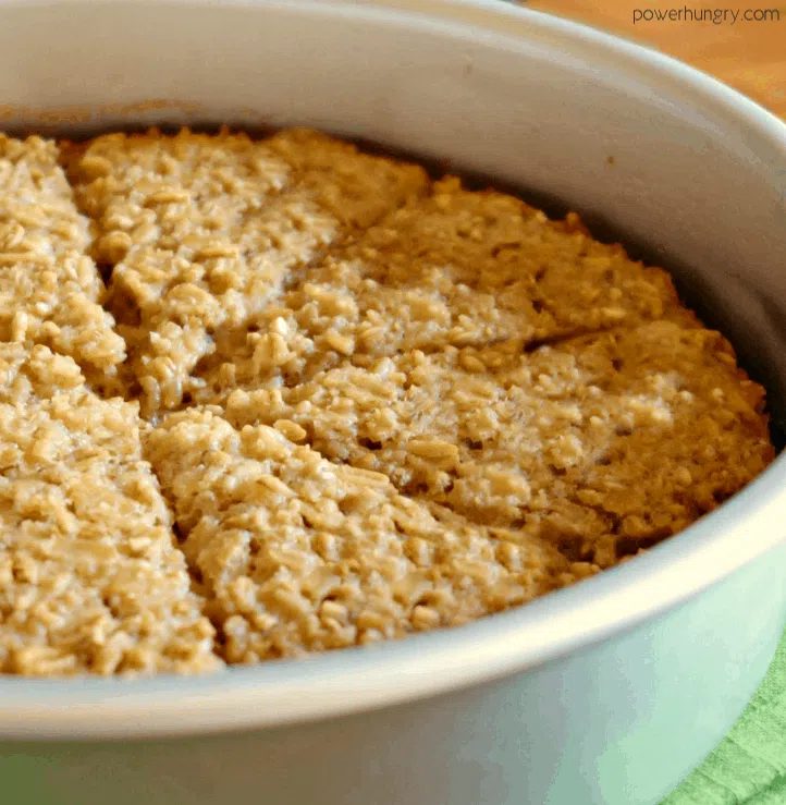 close-up of rustic Irish oat scone bread, in a round baking pan