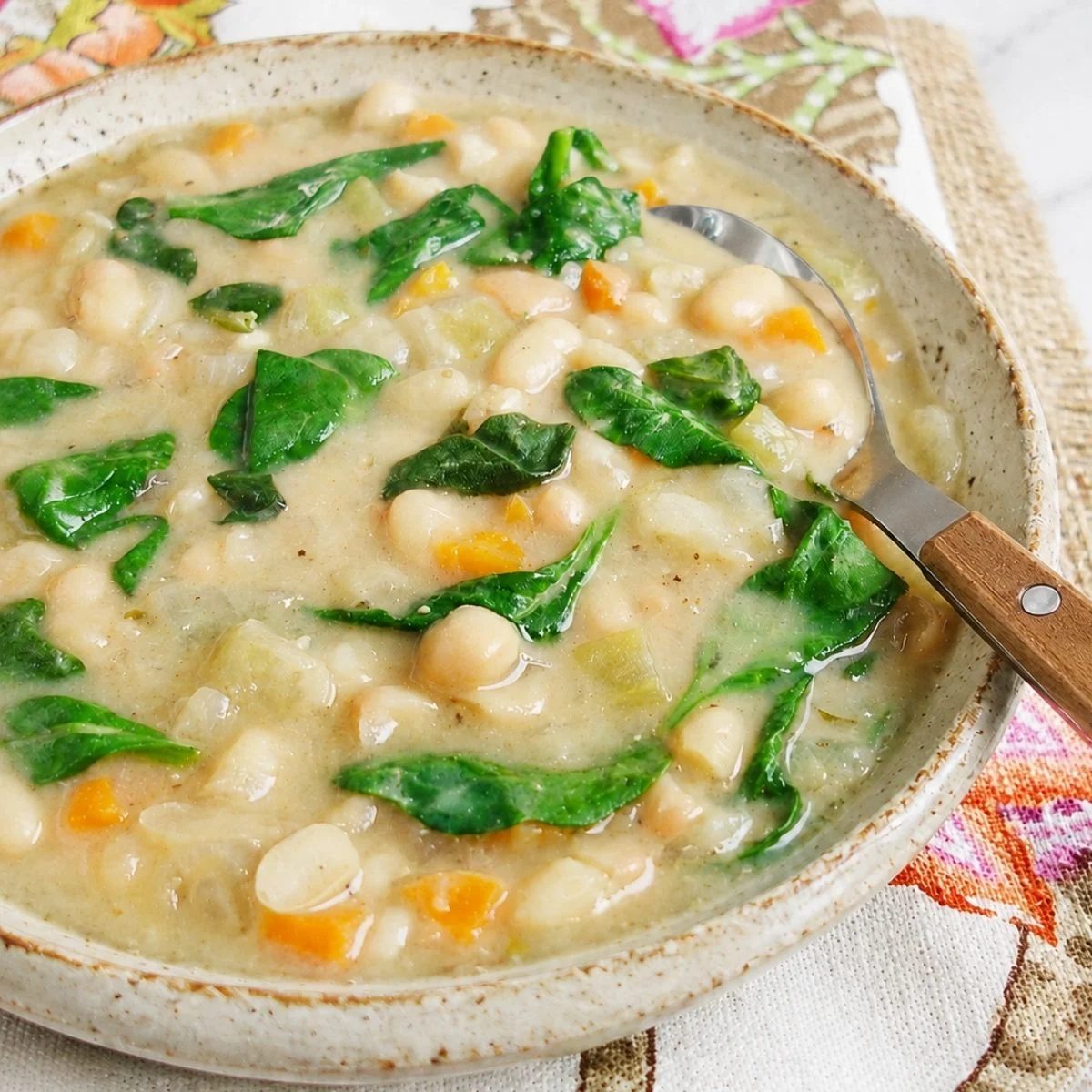 a bowl of high protein vegetarian soup on a floral napkin