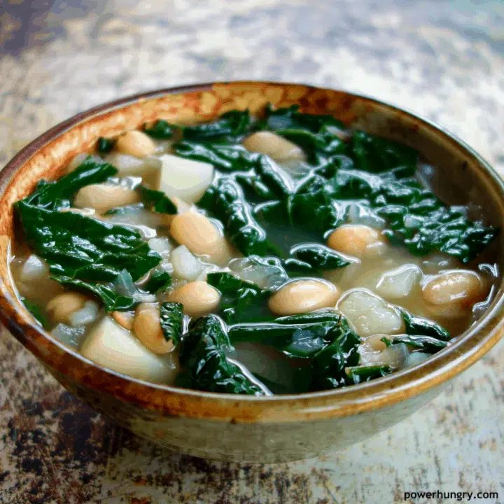 close-up of Kale Potato & White Bean Soup in a potterbowl