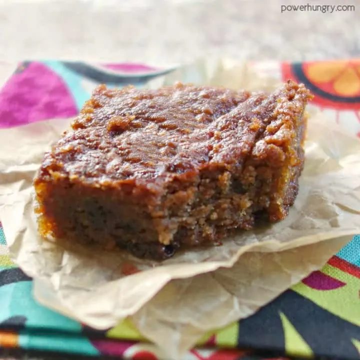 nourishing peanut butter blondie on a piece of parchment paper atop a colorful napkin