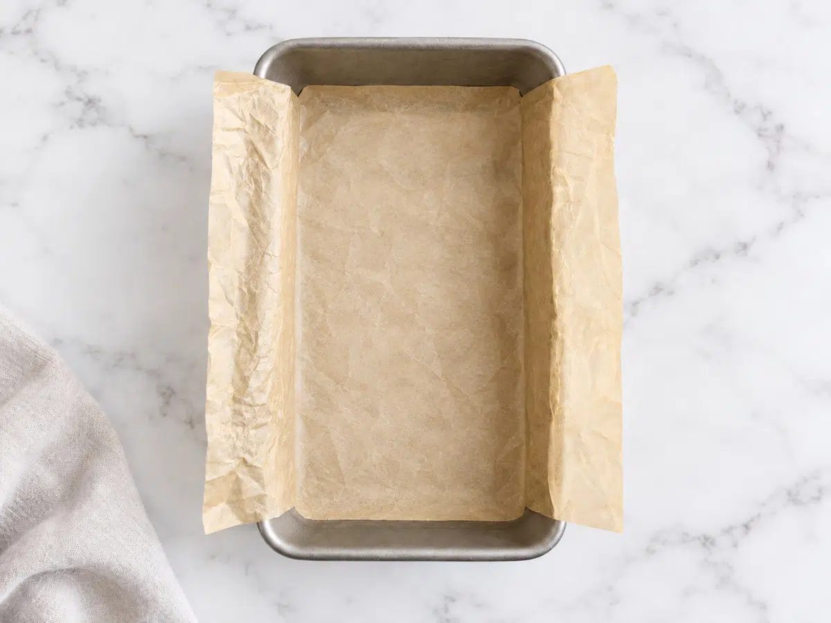 empty parchment lined loaf pan