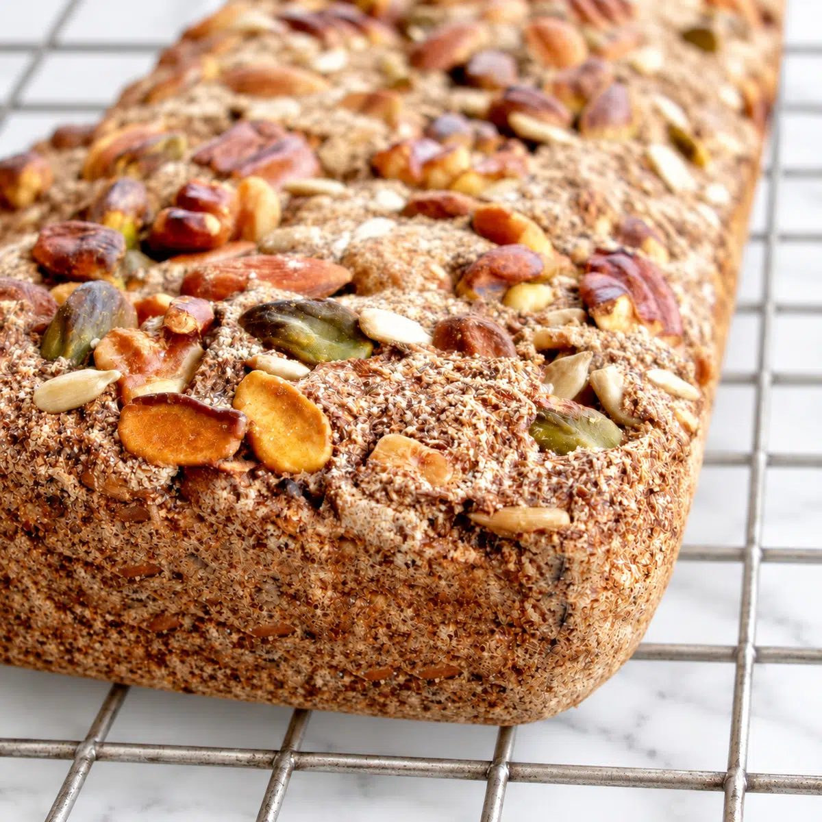 closeup of vegan coconut flour bread on a wire rack