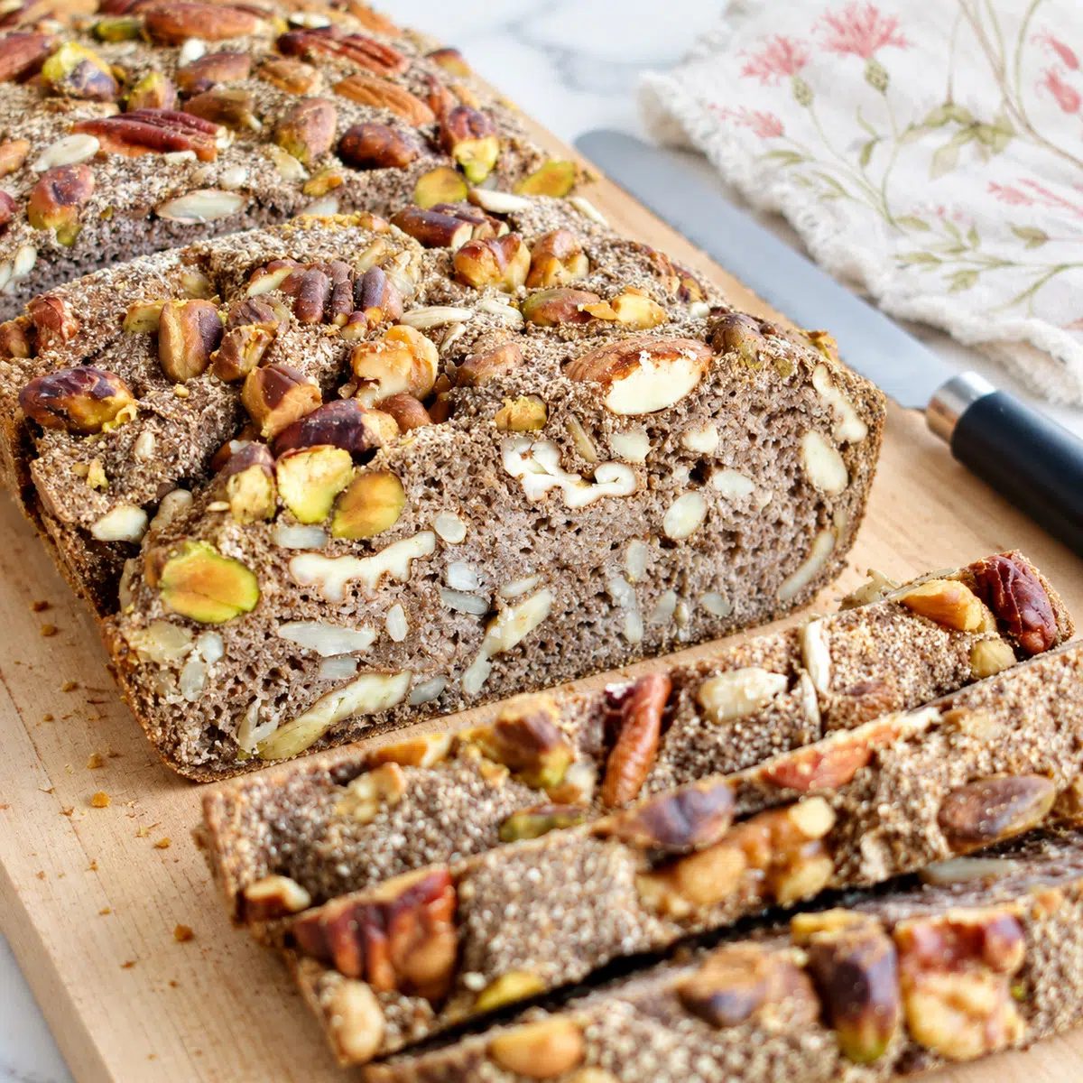 vegan coconut flour bread on a cutting board, sliced