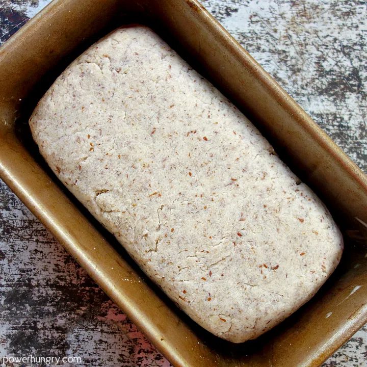 shaped loaf of coconut flour bread dough in a metal loaf pan
