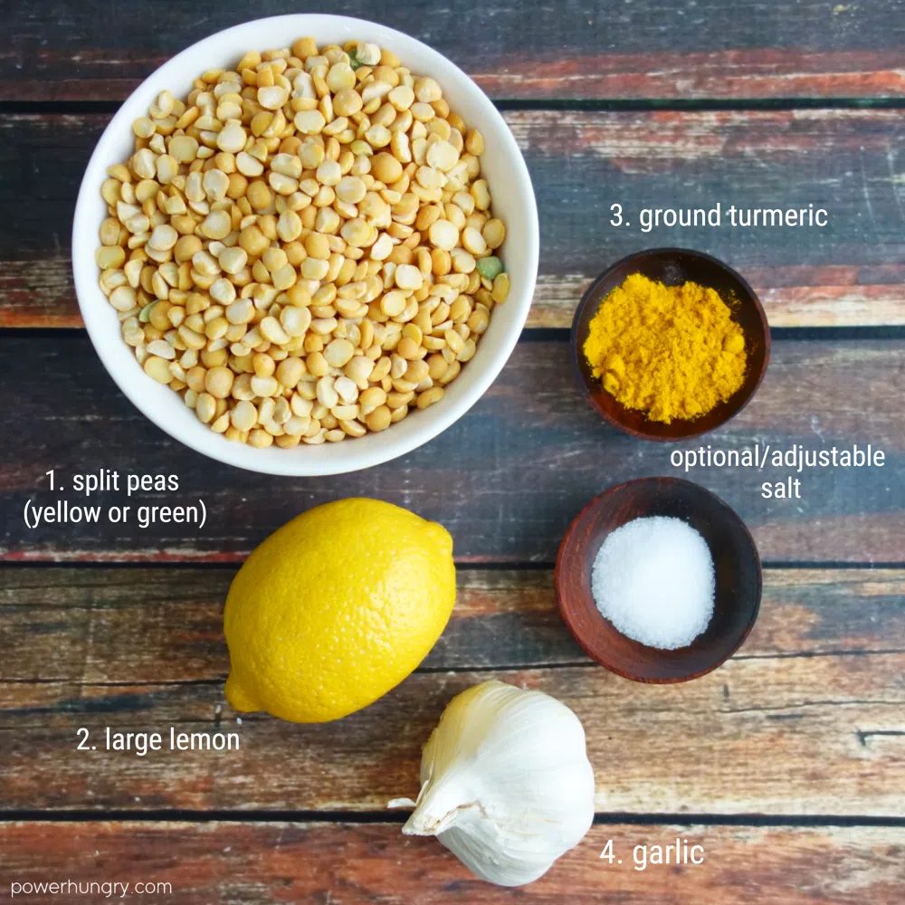 the ingredients for yellow split pea dip on a wooden board