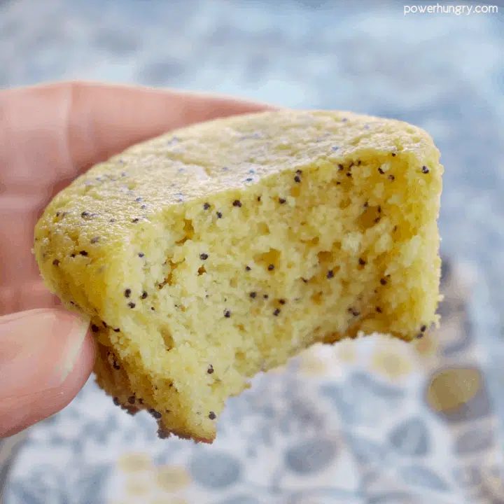 a rain-free vegan lemon poppy seed muffin with a bite taken out