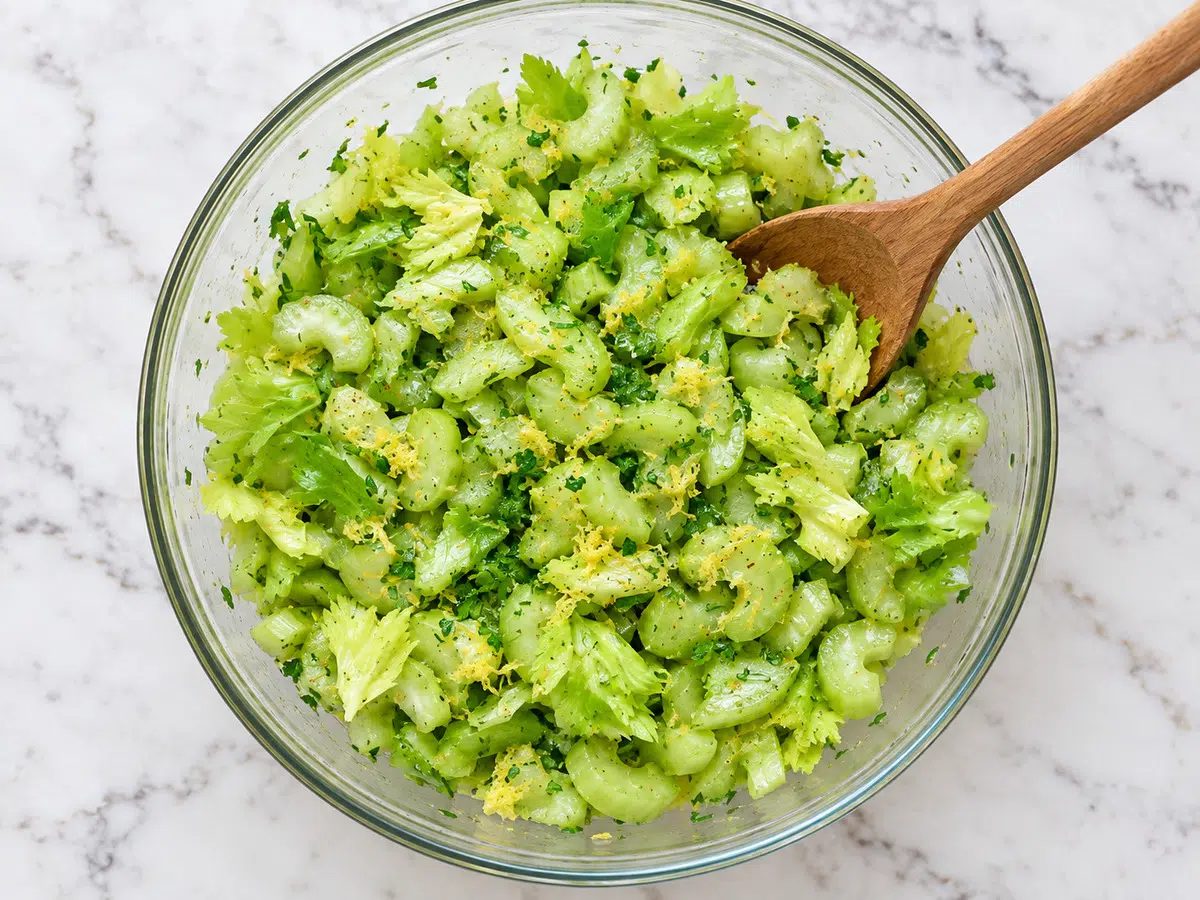lemony celery salad prepped in glass bowl