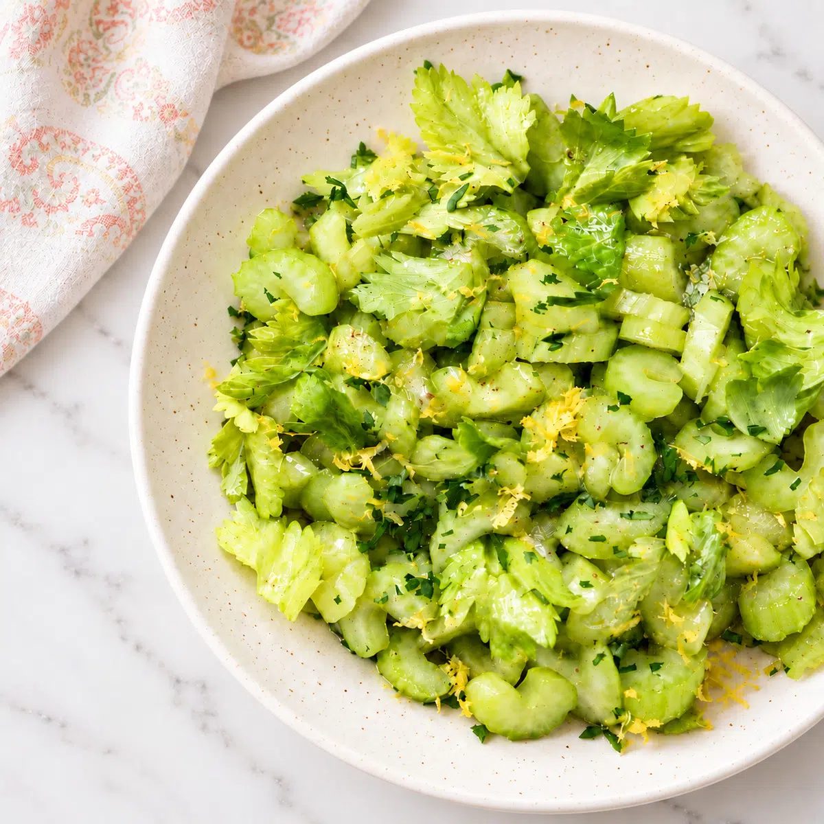 lemony celery salad in a stoneware bowl