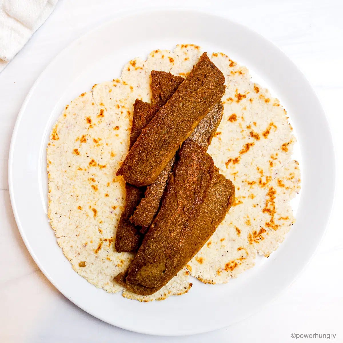lentil tofu gyros on a coconut tortilla