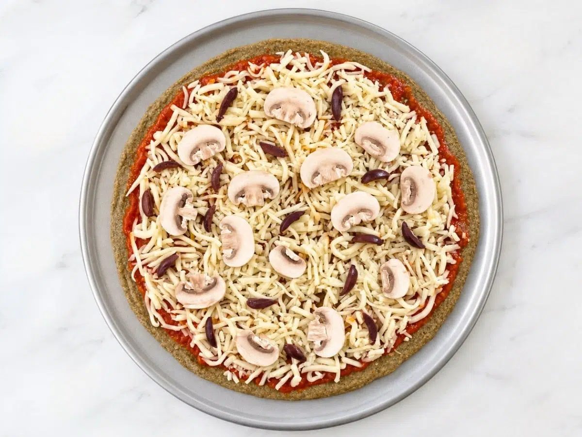 toppings added to the baked 2-ingredient pizza crust