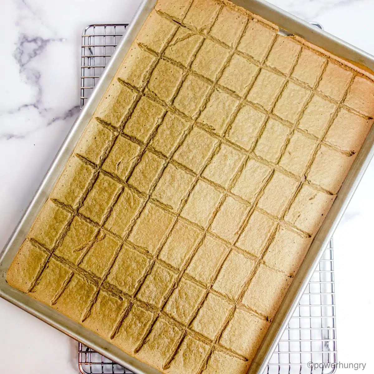 baked lentil crackers cooling on a metal cooling rack