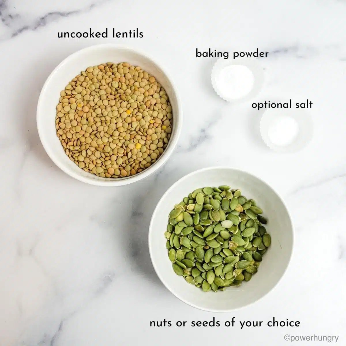 ingredients for lentil crackers in white bowls on a marble counter