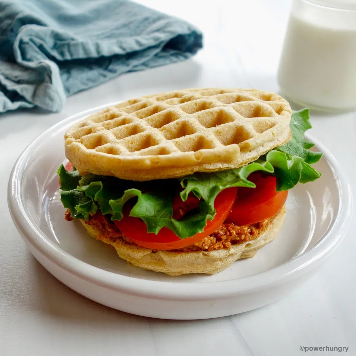 lentil waffle sandwich on a white plate