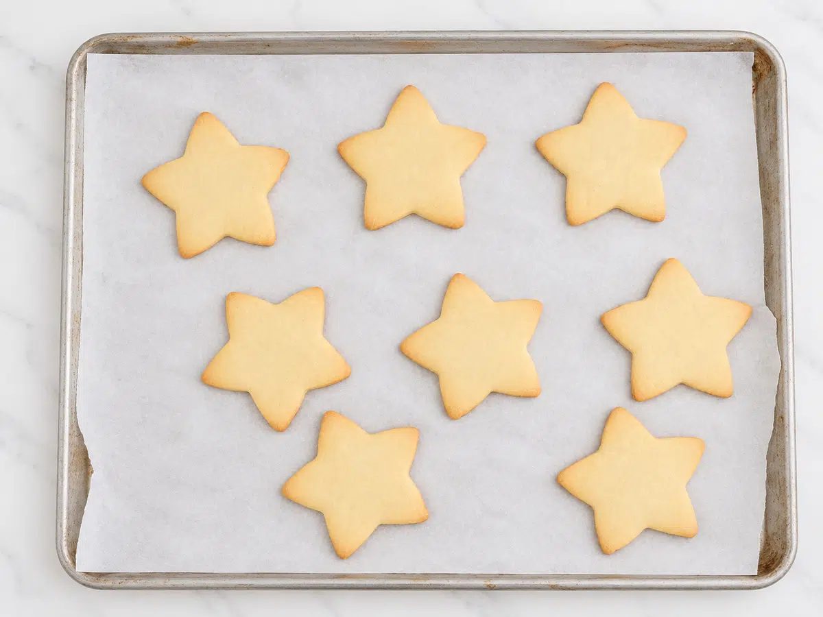 baked cookies on sheet pan for maple almond flour cut out cookies