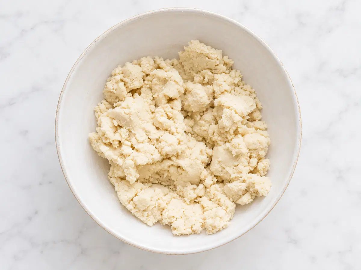 crumbly dough in bowl for the maple almond flour cut out cookies