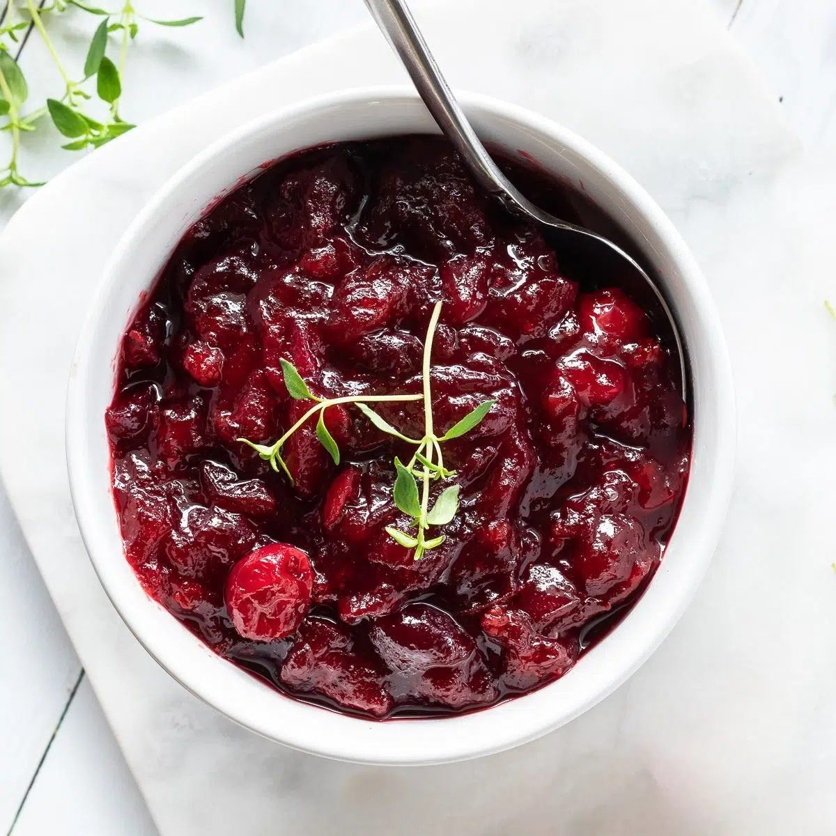 white bowl filled with maple cranberry sauce