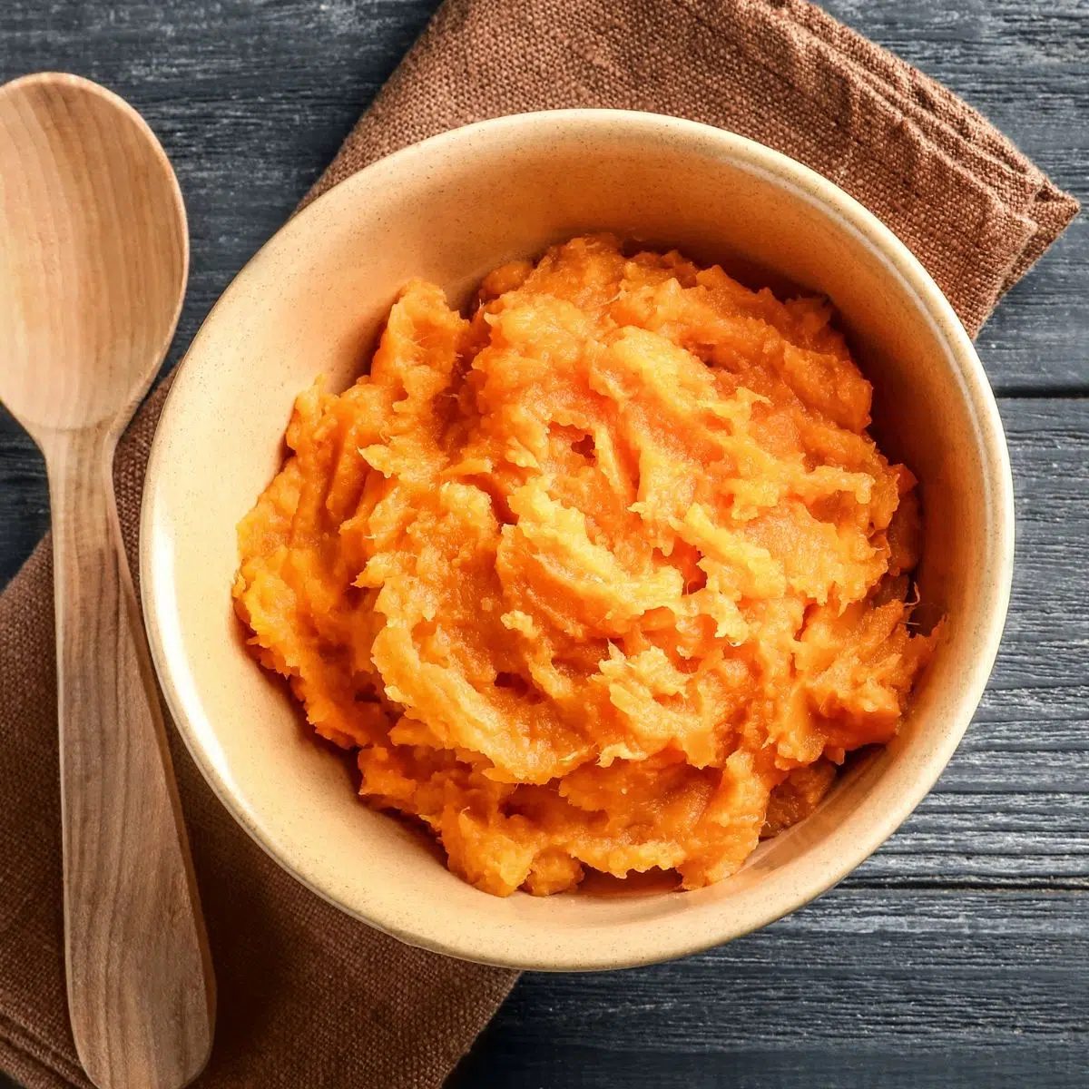 coconut milk mashed sweet potatoes in a wood bowl