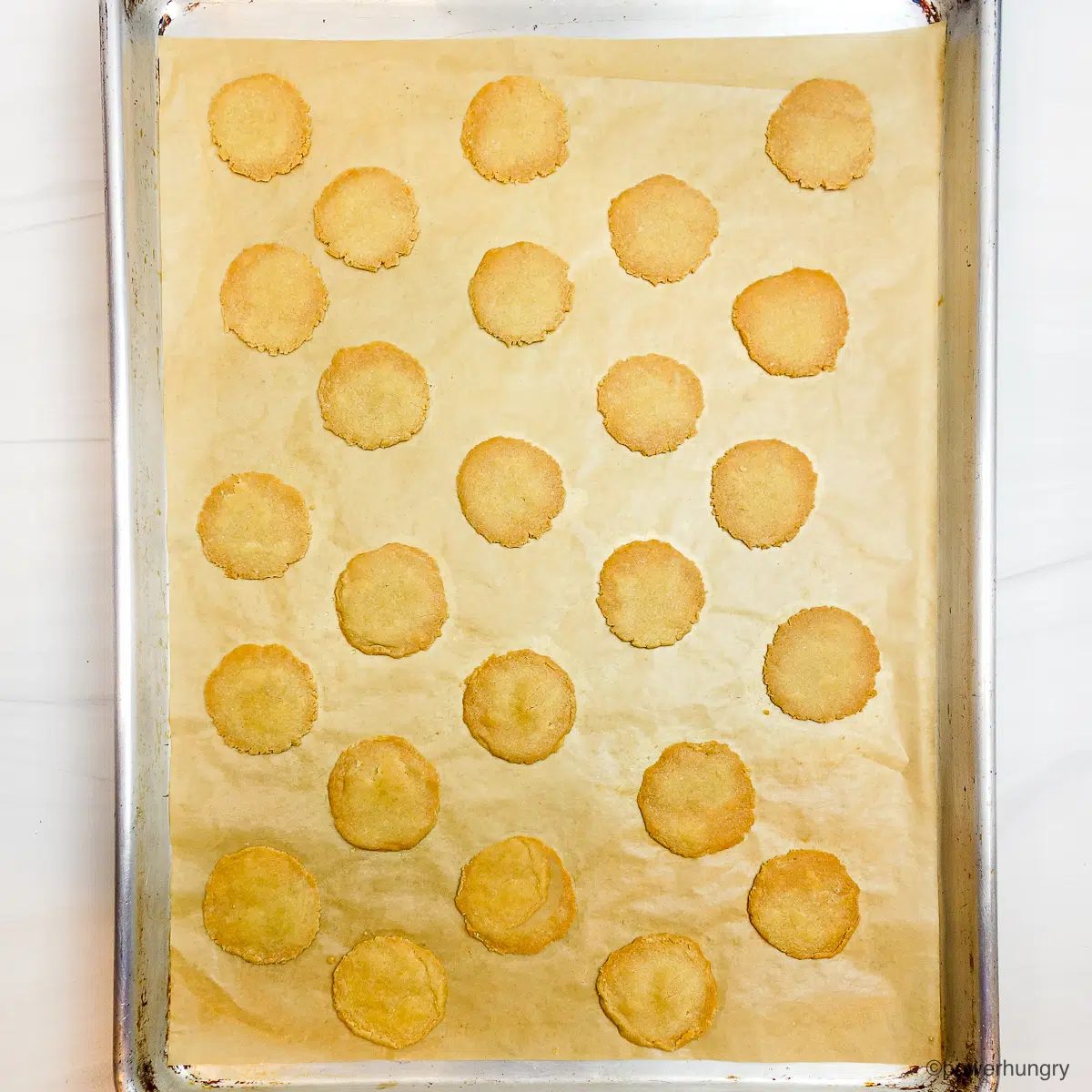baked millet crackers on a baking sheet