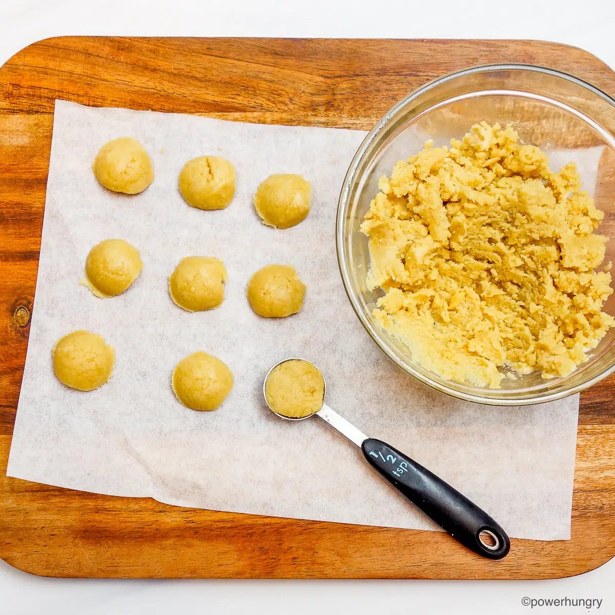 millet cracker dough portions on a cutting board