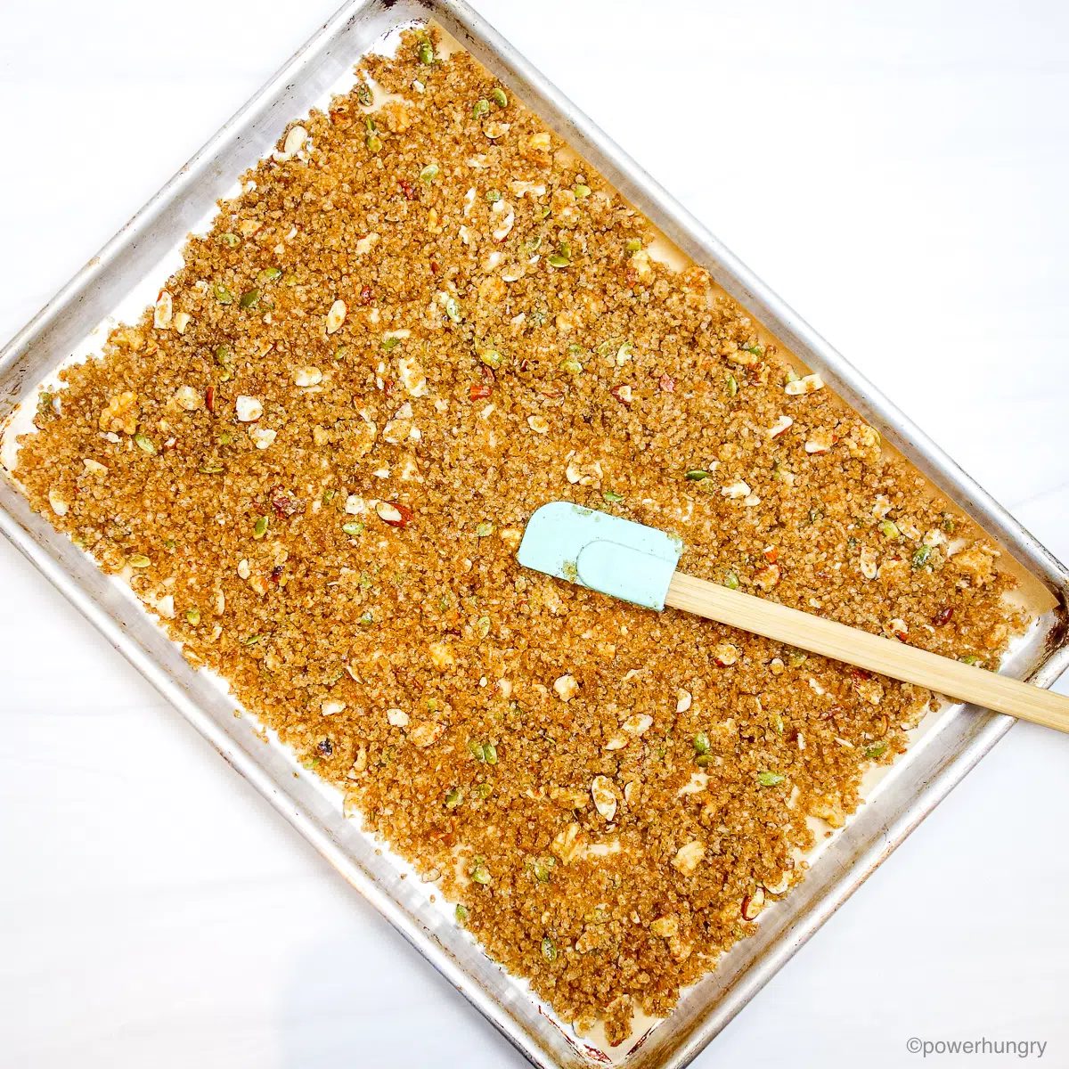unbaked granola on baking sheet
