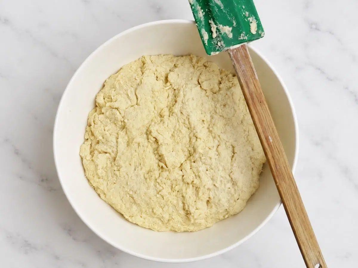 dough for 100% millet sandwich bread in a white bowl