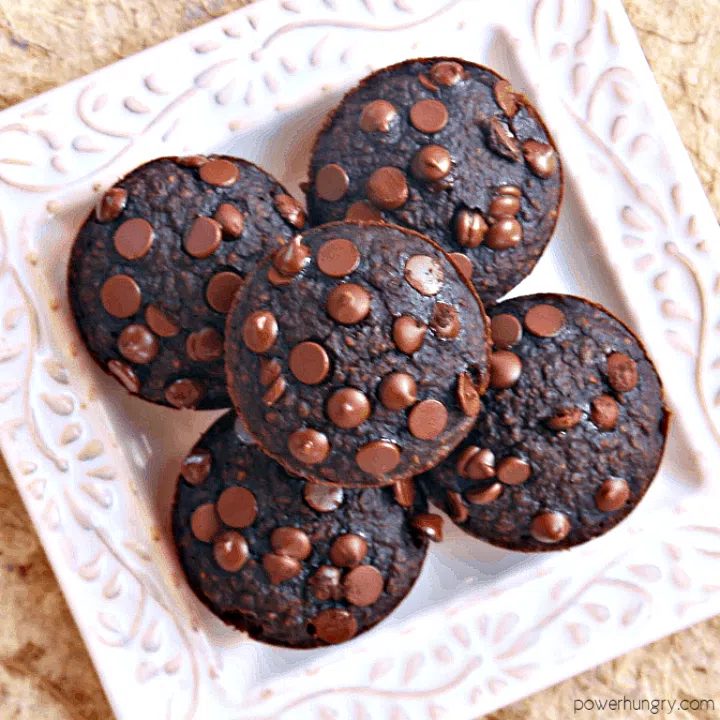 overhead shot of vegan chocolate oat mini muffins on a square white plate