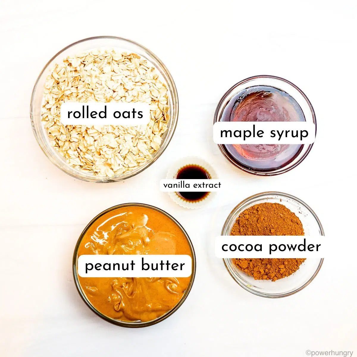 ingredients, in clear glass bowls, for oat no bake cookies