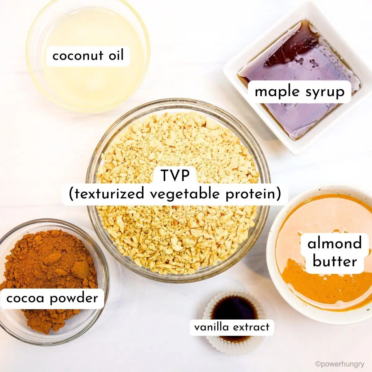 ingredients for no bake tvp cookies, all in glass bowls