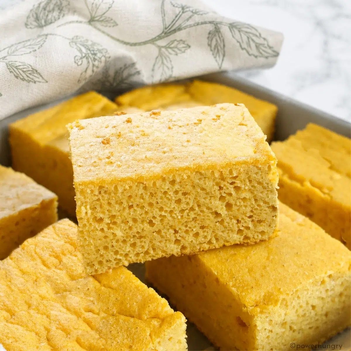 a piece of corn-free cornbread atop several other pieces