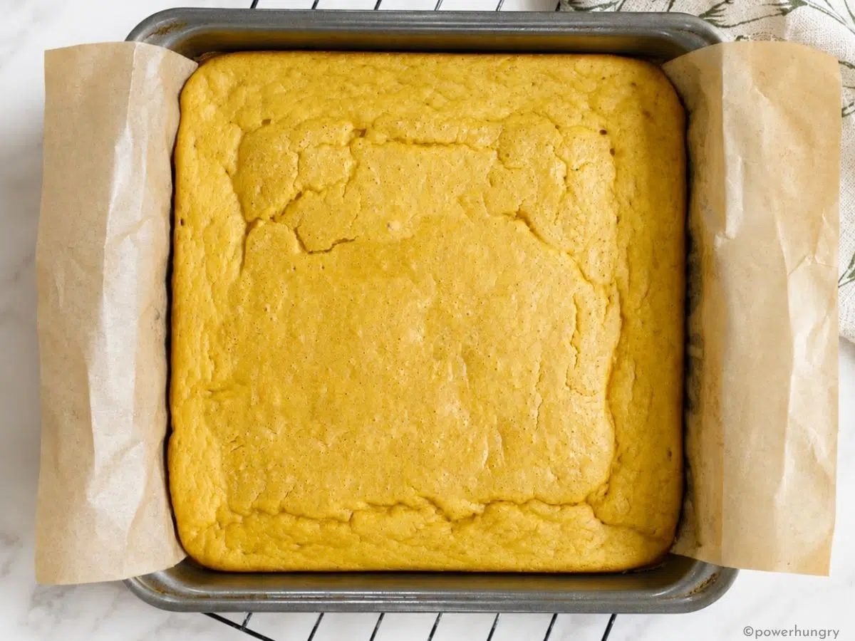 bake no corn cornbread in a baking pan on top of a cooling rack