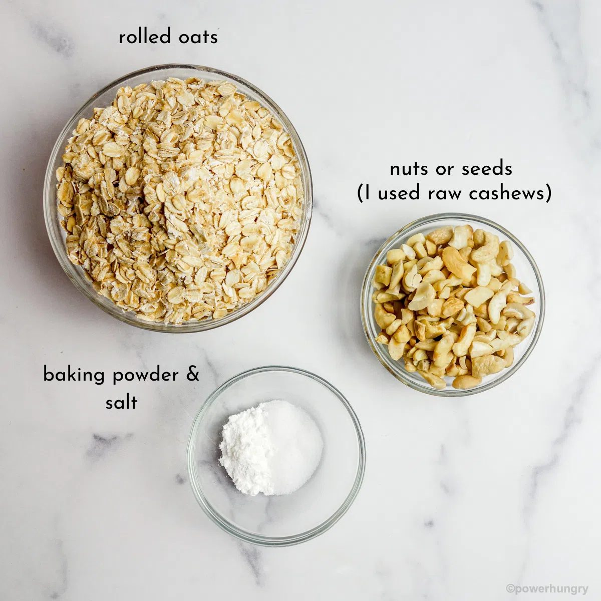 overhead shot of ingredients for vegan no roll oat crackers, set out in glass bowls