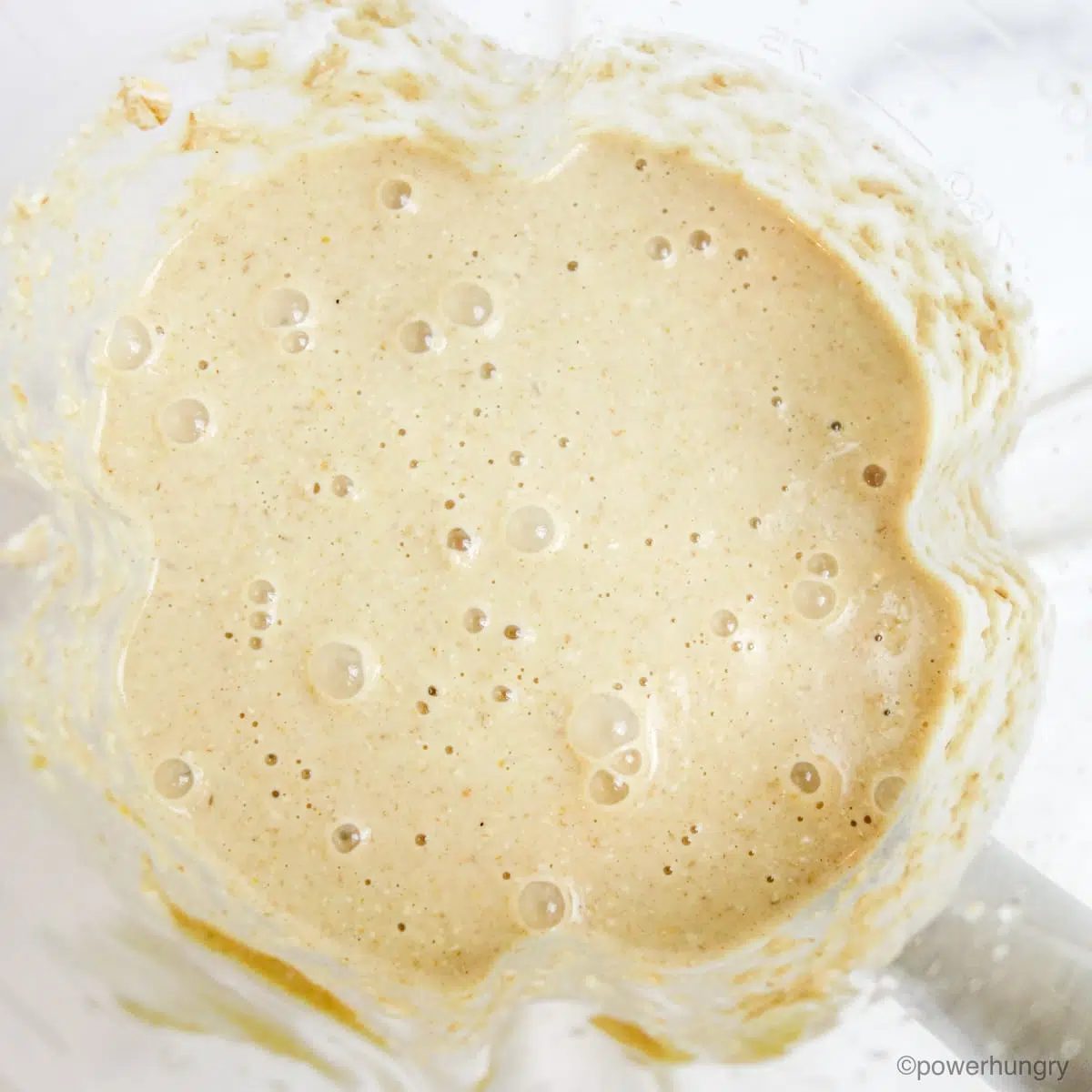 overhead shot of batter for oat muffins in a blender