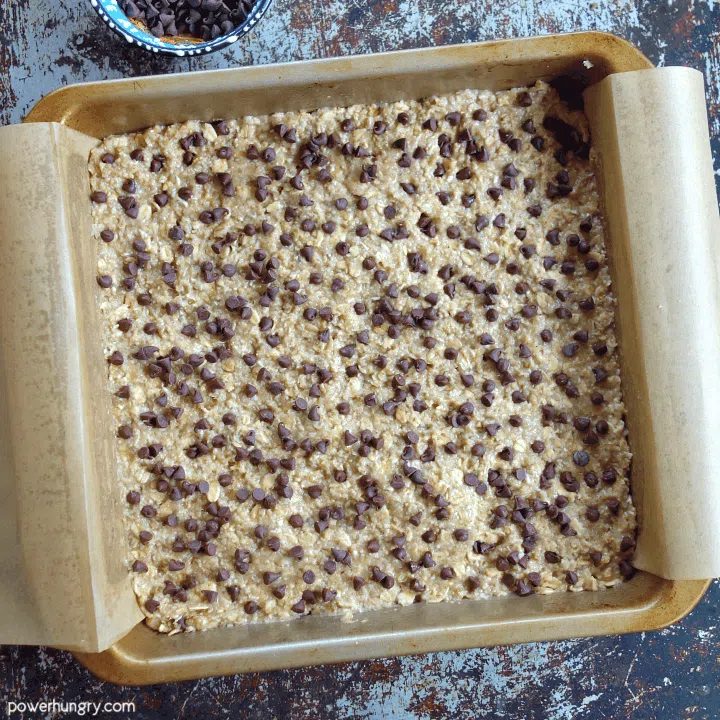 unbaked banana oat almond bars with chocolate chips on top