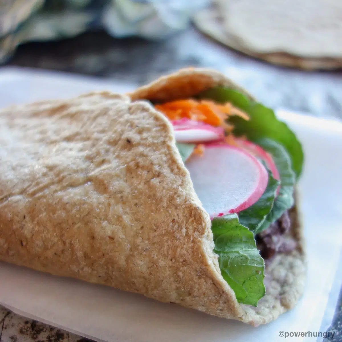oat tortilla filled with vegetables