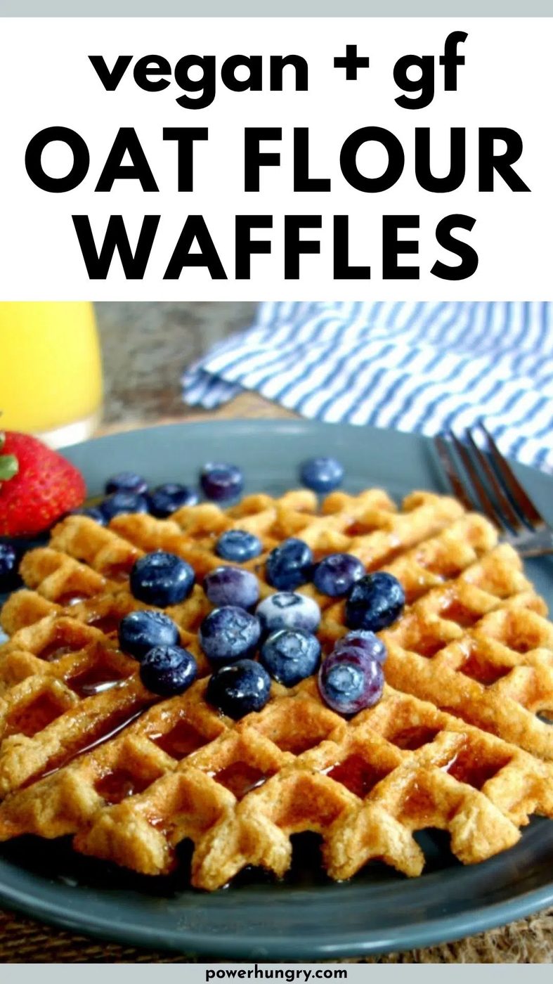 vegan oat flour waffles topped with blueberries and syrup