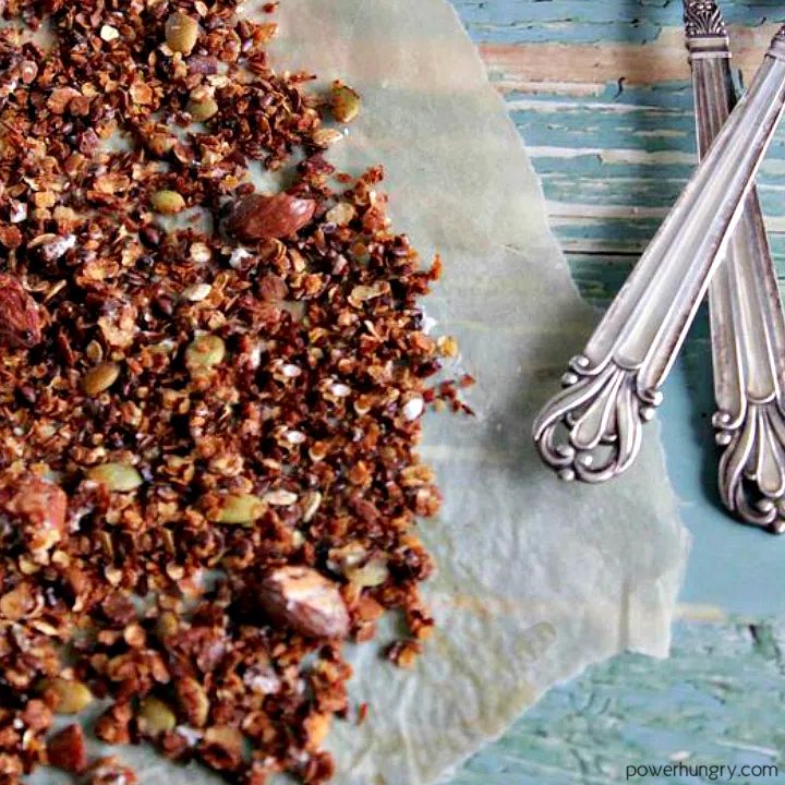 chocolate granola on a piece of brown parchment paper