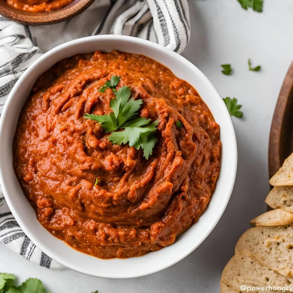 muhammara (red pepper spread) in a white bowl