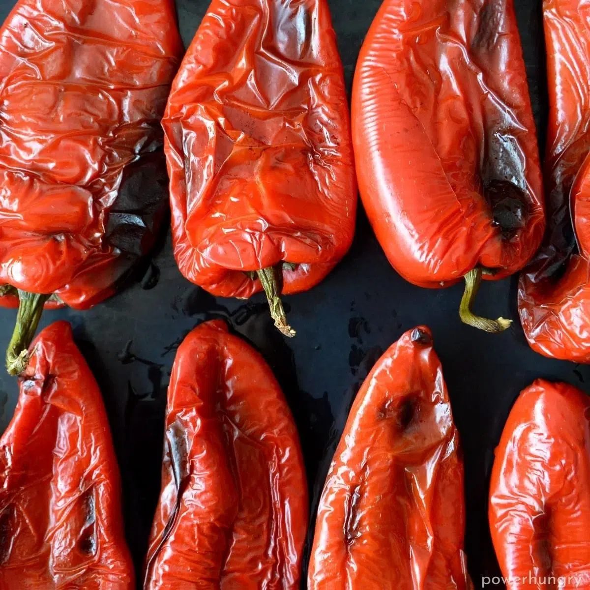 a baking sheet of roasted peppers to be used in oil-free gluten-free muhammara