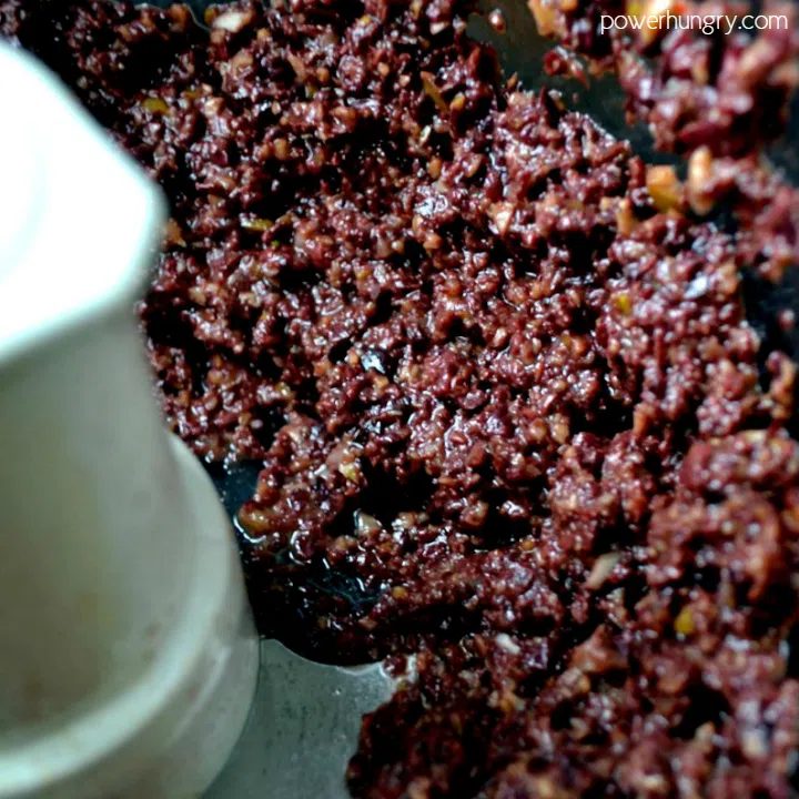 clos-up of food processor with olive tapenade inside t