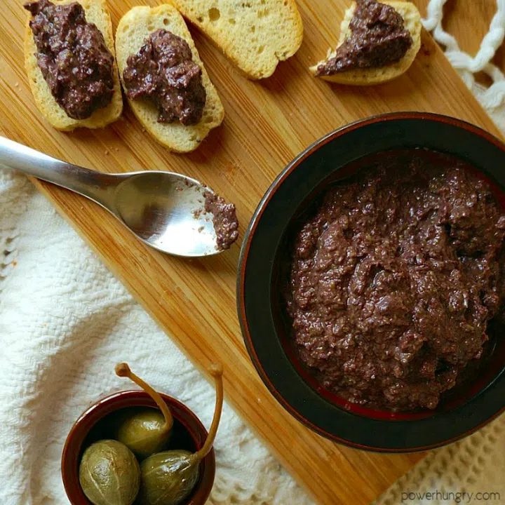 overhead shot of tapenade and toasts with tapenade
