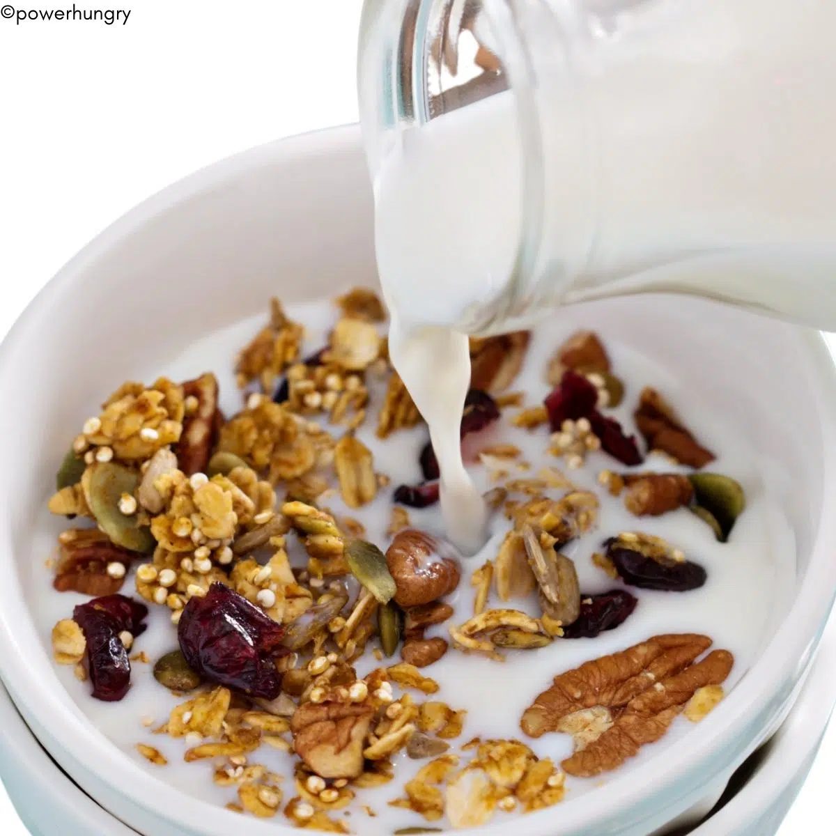oil-free quinoa protein granola with milk poured onto it