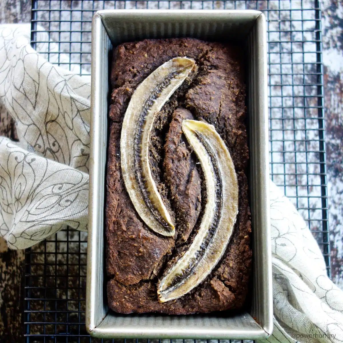 banana bread on a black cooling rack