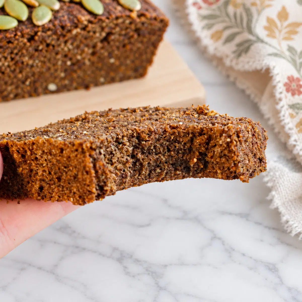 buckwheat pumpkin bread handheld slice close up