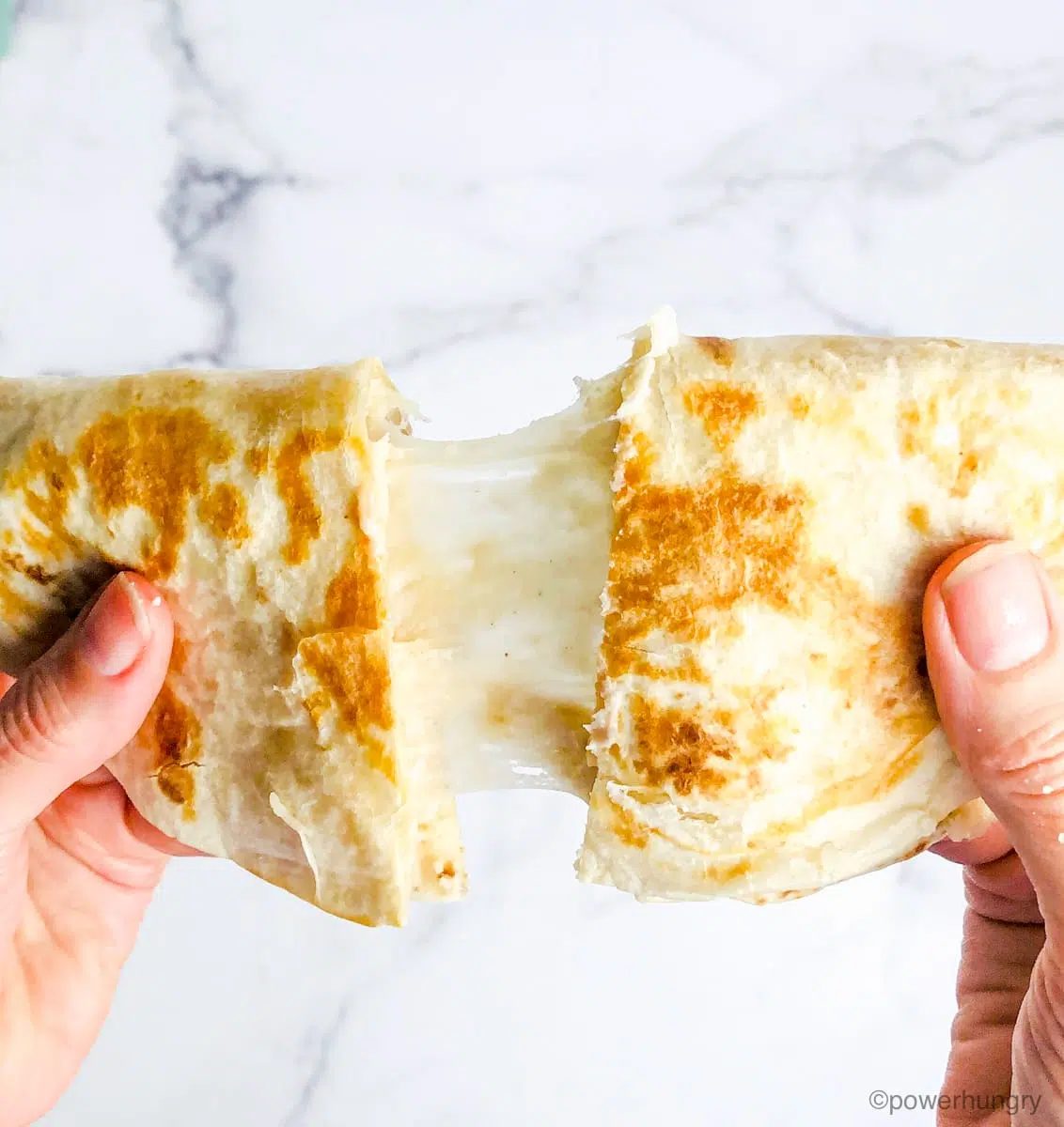 coconut flour tortilla used to make a vegan quesadilla filled with Oil-Free Vegan Mozzarella that Melts, Grates & Slices