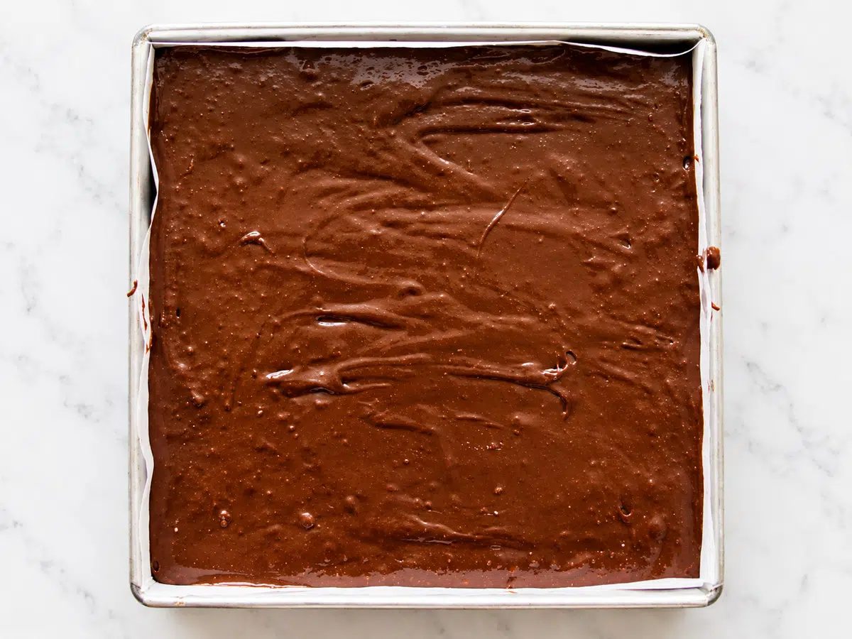 batter spread in baking pan for chickpea flour brownies