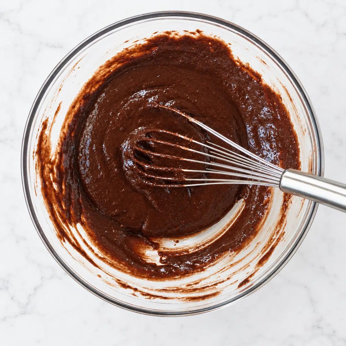 batter for chickpea flour brownies in glass bowl