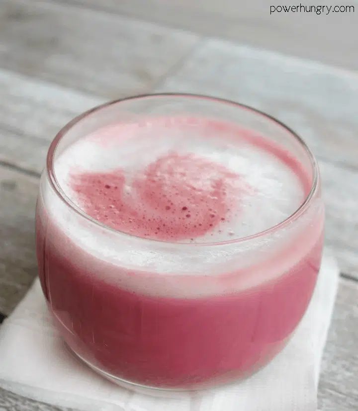 close-up of a vegan pink power latte in a glass cup