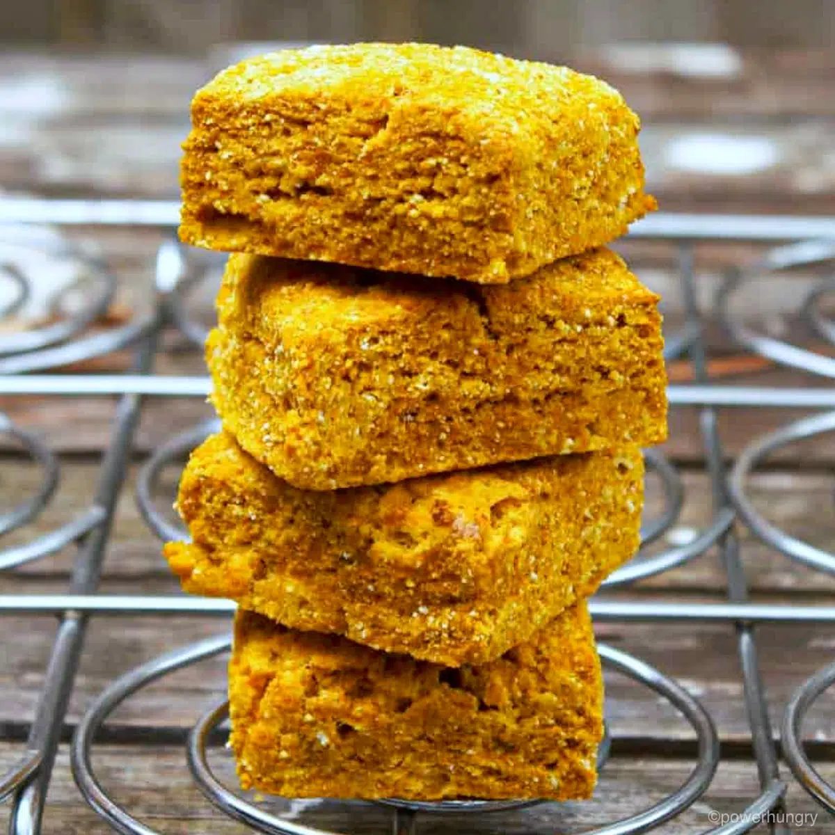 stack of 4 pumpkin biscuits on a cooling rack