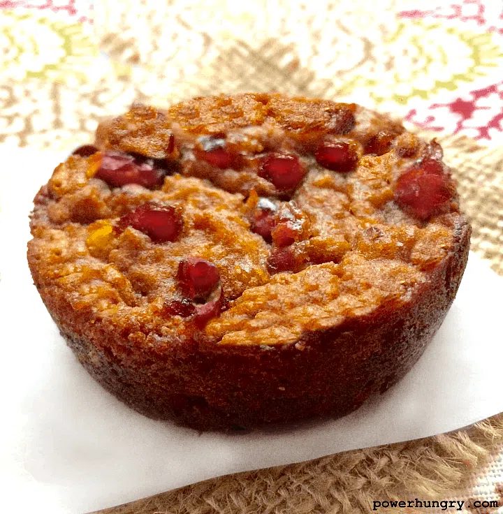 vegan pumpkin cranberry blondie on a piece of parchment paper