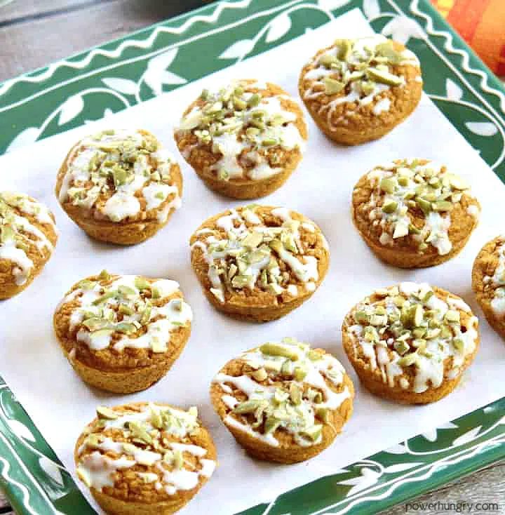 a batch of vegan pumpkin latte blender muffins on a green and white plate